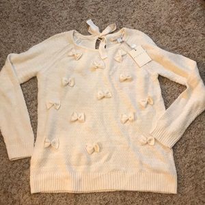 Cream sweater with bows